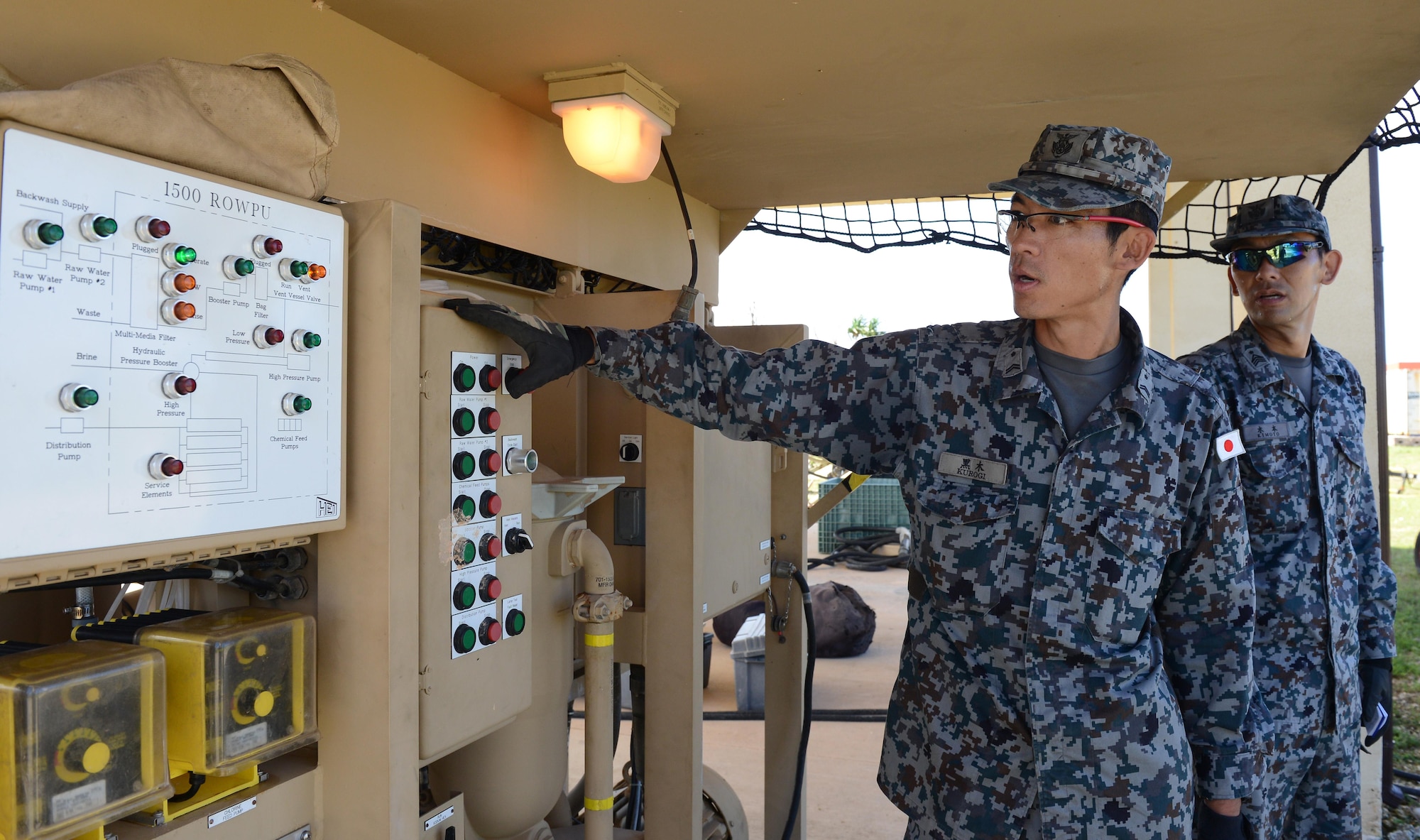 Airmen with the Japan Air Self-Defense Force operate a reverse osmosis water purification unit during Silver Flag Dec. 6, 2016, at Northwest Field, Guam. Silver Flag is a U.S. Pacific Command multilateral subject matter expert exchange led by engineers from the 554th RED HORSE Squadron. The exercise is designed to build partnerships and promote interoperability through the equitable exchange of civil engineer-related information. (U.S. Air Force photo by Senior Airman Arielle K. Vasquez/Released)