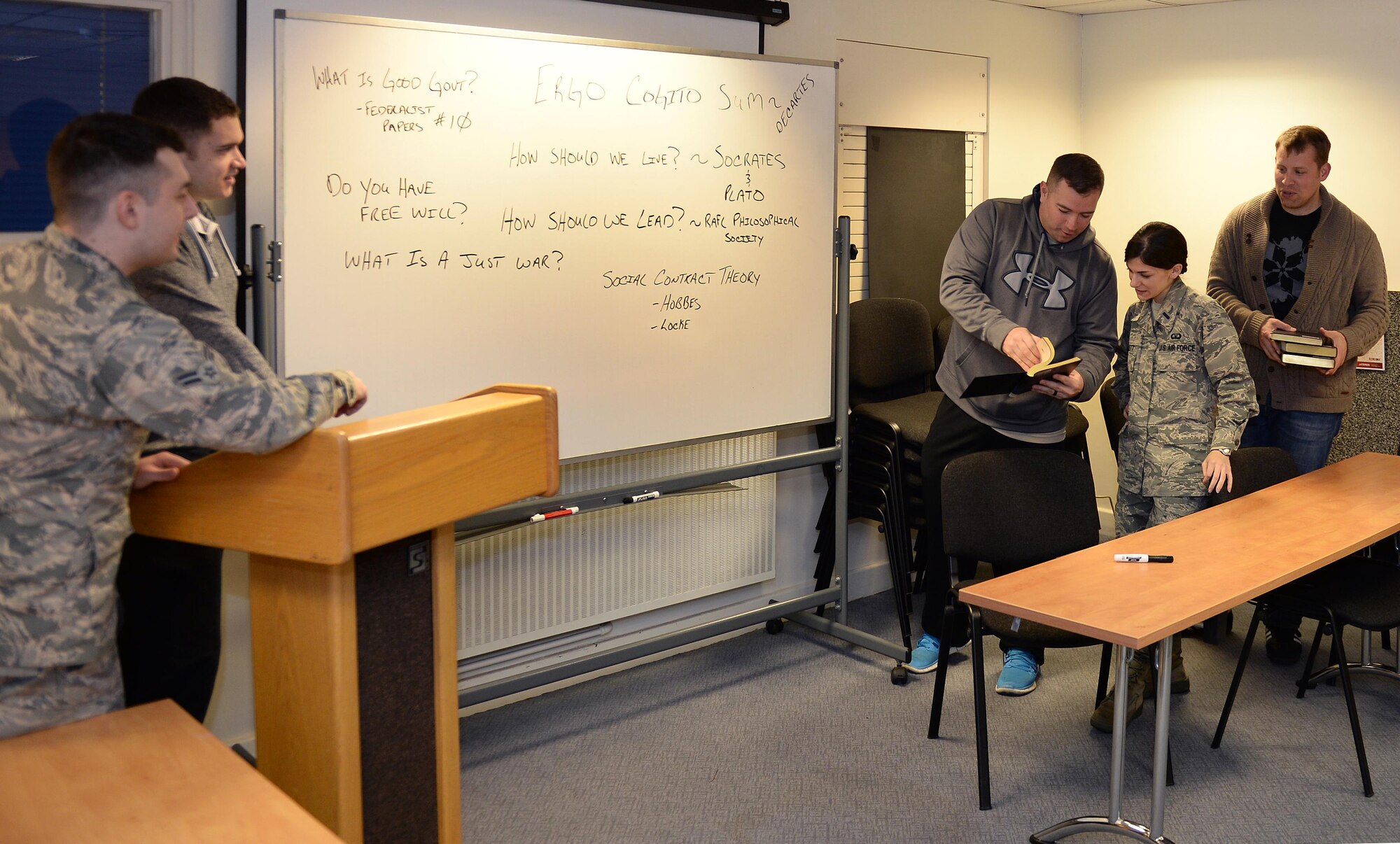 Members of the Lakenheath Philosophical Society discuss free will during a meeting at Royal Air Force Lakenheath, England, Dec. 5. The Society, established at RAF Lakenheath, hopes to spread across the service and plans to make the next addition at Ramstein Air Base, Germany. (U.S. Air Force photo/ Staff Sgt. Emerson Nunez)