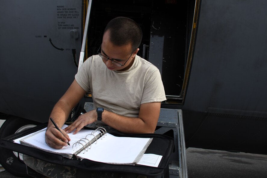 Airman 1st Class Jaime Gurrola, a 386th Expeditionary Aircraft Maintenance Squadron aerospace maintenance journeyman, prepares required forms for tire removal Dec. 5, 2016 at an undisclosed location in Southwest Asia. The aerospace maintainers installed new tires on an EC-130H Compass Call as part of preventive maintenance. (U.S. Air Force photo/Senior Airman Andrew Park)
