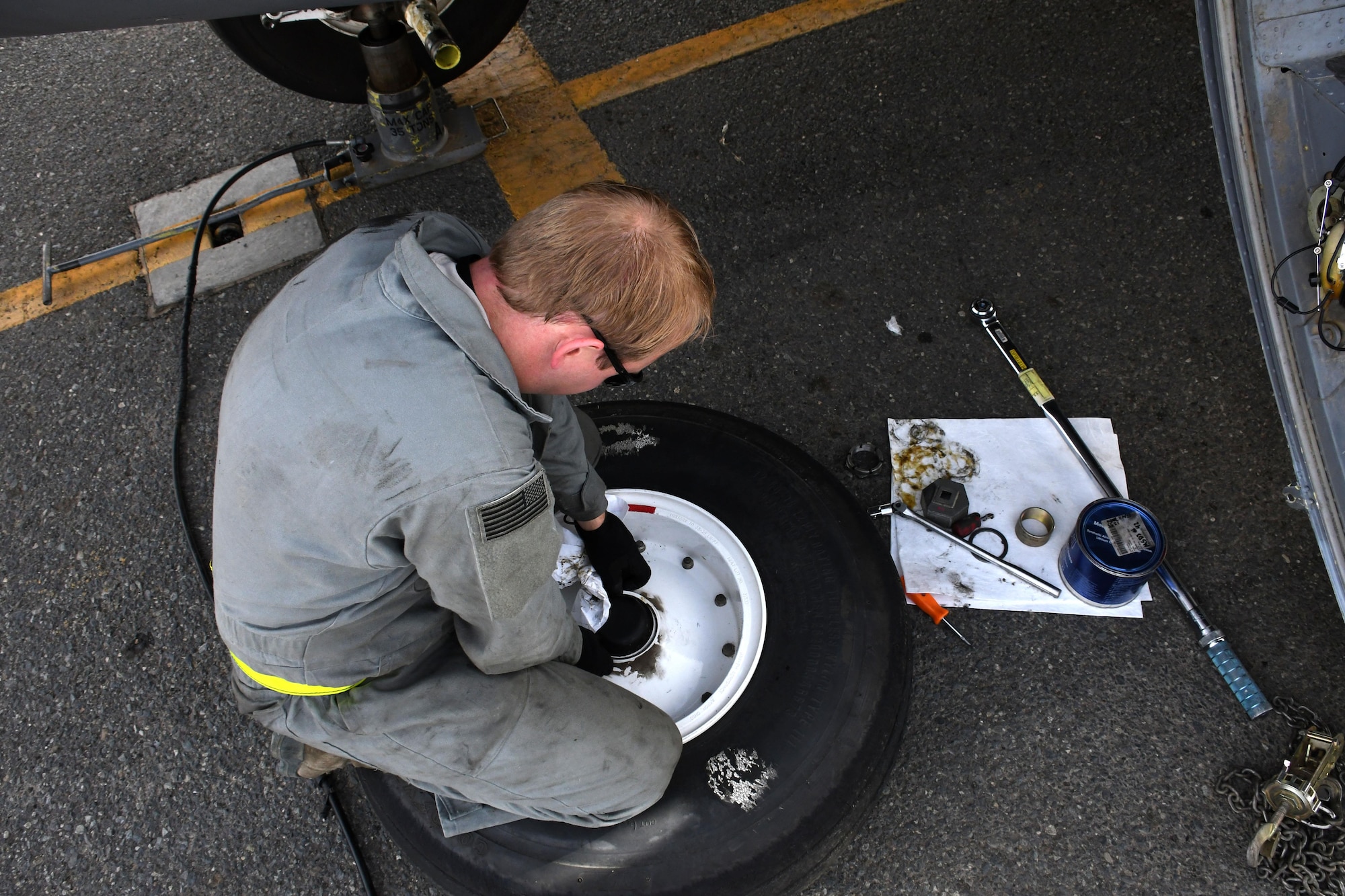 Staff Sgt. Sean Jones, a 386th Expeditionary Aircraft Maintenance Squadron aerospace maintenance craftsman, reassembles a wheel after removing it from an EC-130H Compass Call Dec. 5, 2016 at an undisclosed location in Southwest Asia. The wheel and tire must be reassembled before shipping it off to the wheel and tire back shop. (U.S. Air Force photo/Senior Airman Andrew Park)