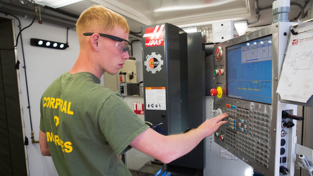 U.S. Marine Cpl. Rusty Mongold, a machinist with Engineer Maintenance Company, 1st Maintenance Battalion, 1st Marine Logistics Group, cuts a piece of metal using the Computer Numerical Control during exercise Steel Knight at Marine Corps Air Ground Combat Center Twentynine Palms, Calif., Dec. 8, 2016. Steel Knight 2017 is a 1st Marine Division-led exercise that exposes Marines and Sailors to skill sets necessary to operate as a fully capable Marine air ground task force. Mongold is from Port Arthur, Texas. 