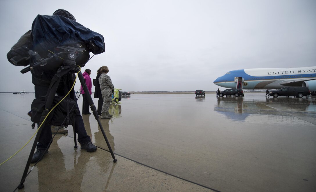 Airman 1st Class Valentina Lopez, 11th Wing Public Affairs photojournalist, stands with an NBC video broadcaster on the flightline during a presidential movement at Joint Base Andrews, Md., Dec. 9, 2016. Civilian media is always present for presidential movements and it’s the responsibility of 11 WG PA to escort media on and off base.  (U.S. Air Force photo by Senior Airman Philip Bryant)