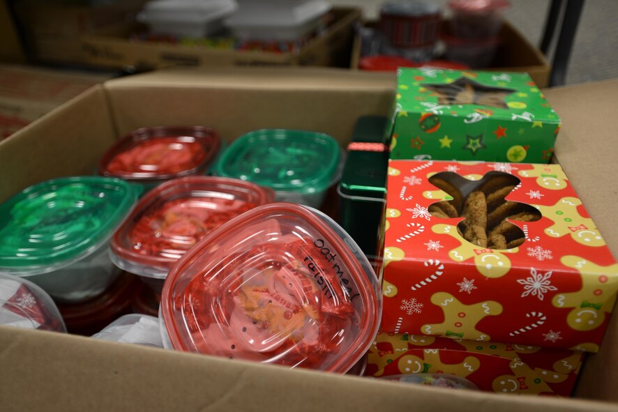 Cookies await sorting during the annual cookie drive at Shaw Air Force Base, S.C., Dec. 8, 2016. Donated by members of the Greater Sumter community, the cookies and accompanying cards were sent to deployed Team Shaw members and delivered to those living in the dorms on Shaw AFB, Fort Jackson, S.C., local community outreach shelters, and the local chapter of the YWCA. (U.S. Air Force photo by Airman 1st Class Kelsey Tucker)