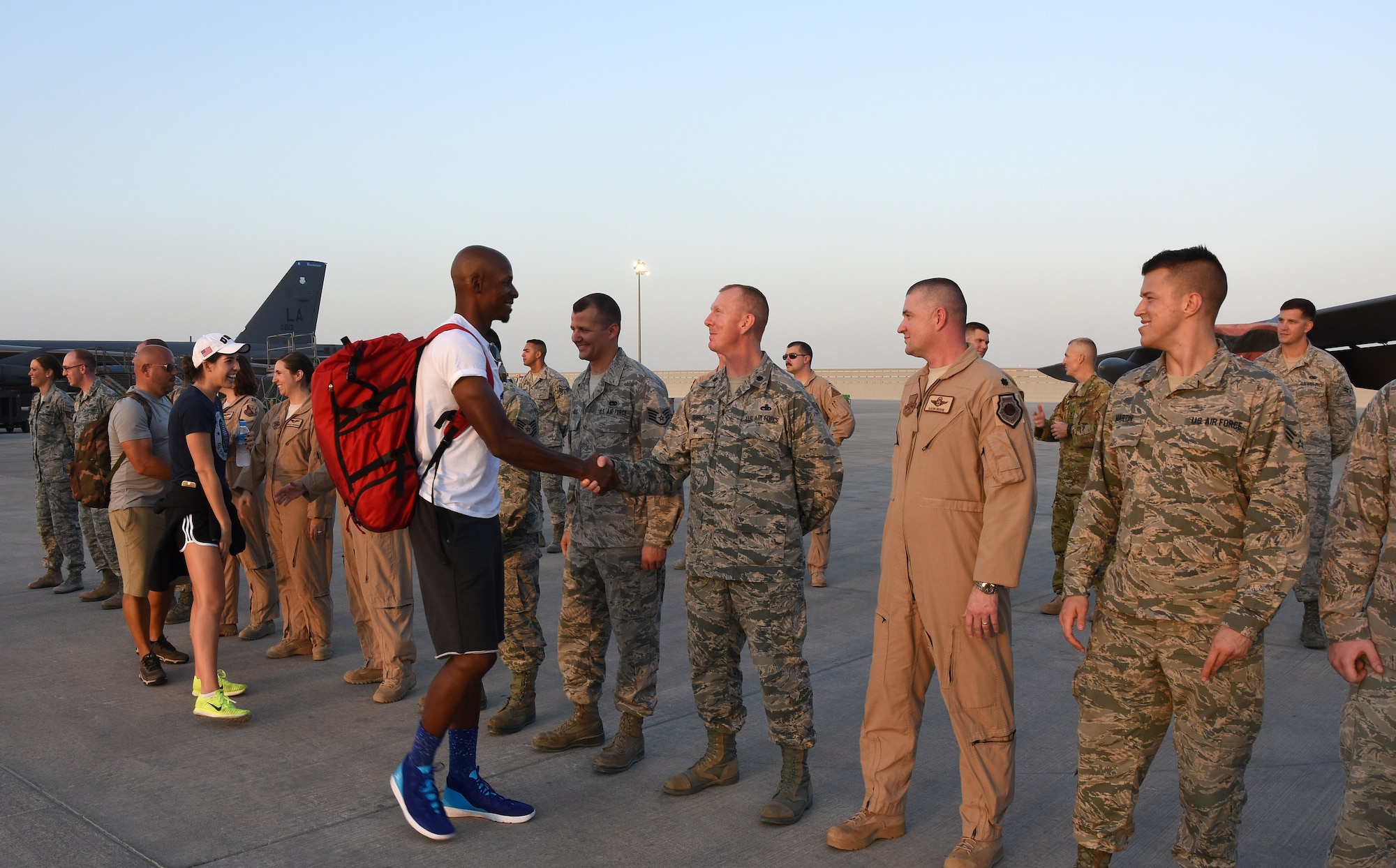 Ray Allen, a retired National Basketball Association player, and Maya DiRado, a U.S. Olympic swimmer and medalist, meet with Airmen during a USO entertainment tour at Al Udeid Air Base, Qatar, Dec. 6, 2016. The tour featured four other guests including country singer Craig Campbell, actor Chris Evans, actress Scarlett Johansson, and mentalist and entertainer Jim Karol. (U.S. Air Force photo by Senior Airman Cynthia A. Innocenti)