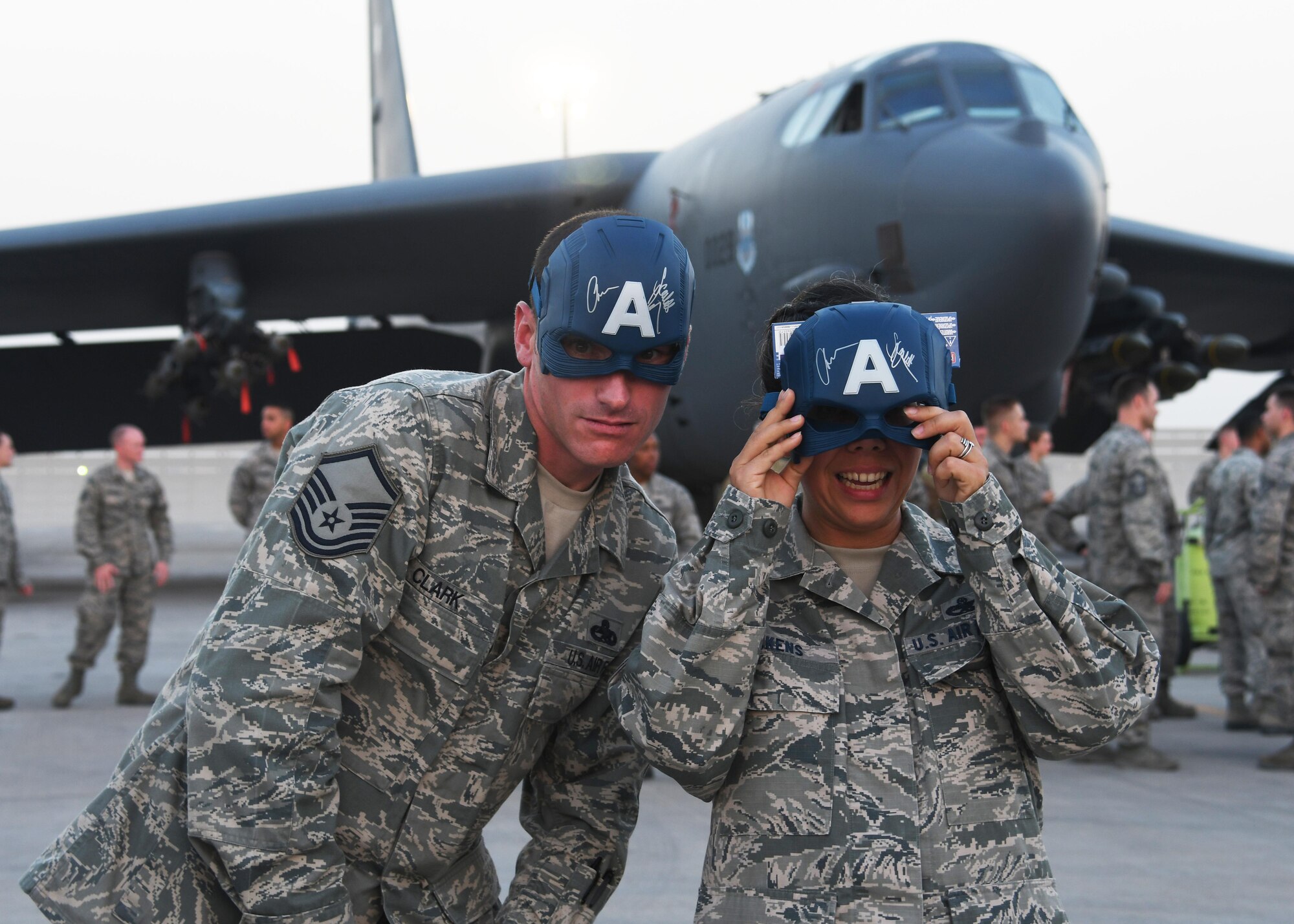 U.S. service members pose with autographed masks in front of a bomber aircraft at Al Udeid Air Base, Qatar, Dec. 6, 2016. The masks were signed by actor Chris Evans, who came to Al Udeid as part of a holiday USO tour. (U.S. Air Force photo by Senior Airman Miles Wilson)
