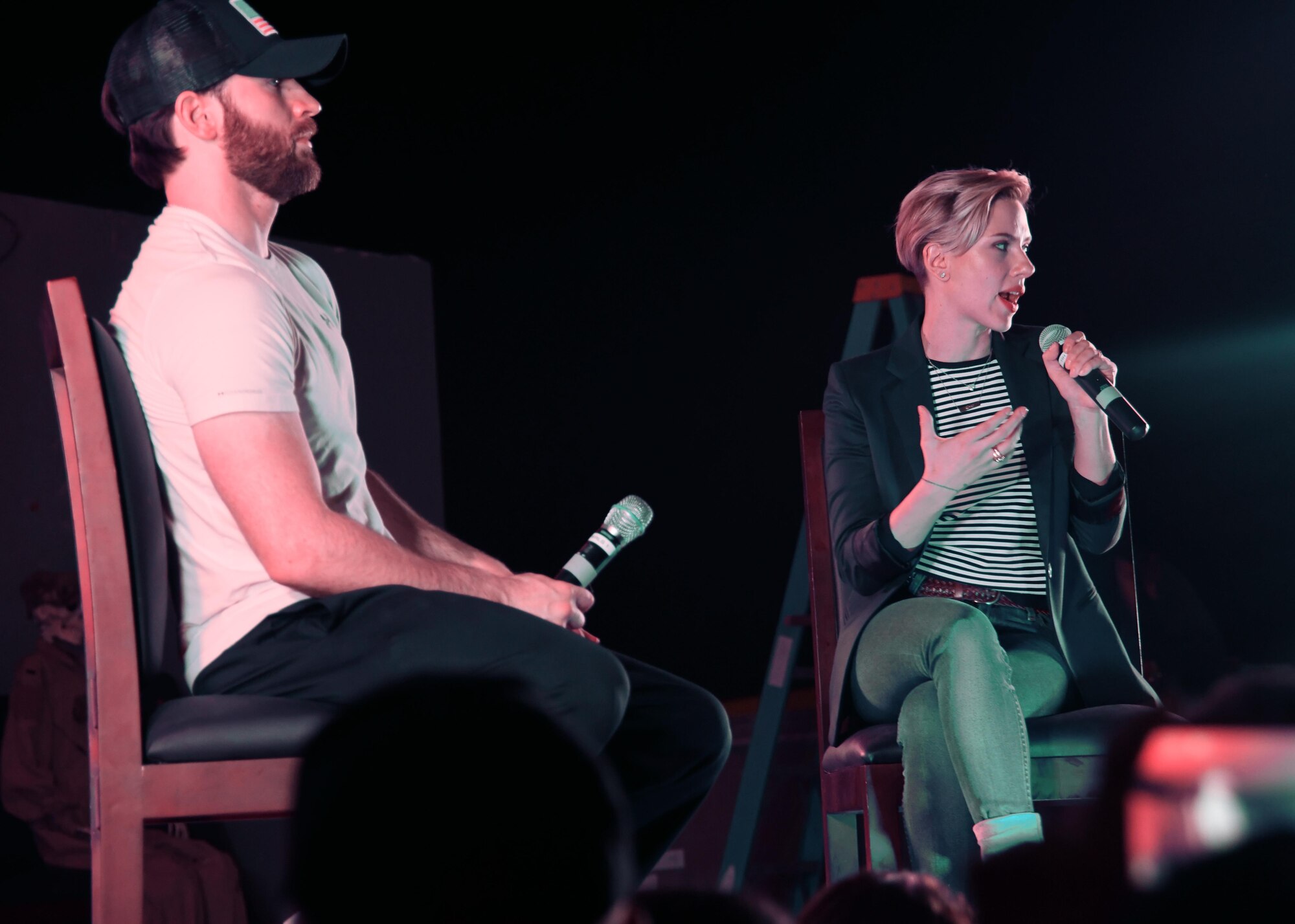 Actor Chris Evans and actress Scarlet Johansson speak to U.S. service members during a USO holiday tour at Al Udeid Air Base, Qatar, Dec. 6, 2016. The Evans and Johansson held a question and answer session during a portion of the tour, which was followed by an opportunity for the service members to take group photos with the celebrities. (U.S. Air Force photo by Senior Airman Miles Wilson)