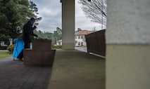Capt. Ryan Tamez, 450th Intelligence Squadron weapons and tactics flight commander, sweeps a pavilion to prepare for the Fisher House’s tree-lighting ceremony at Landstuhl Regional Medical Center, Germany, Dec. 2, 2016. Several Airmen assigned to 450th IS helped distribute cookies, set up and tear down the event as a part of the squadron’s second annual service day. On the first Friday of December, the 450th IS Airmen volunteered throughout the Kaiserslautern Military Community as their way to give back to the community. (U.S. Air Force photo by Senior Airman Tryphena Mayhugh)