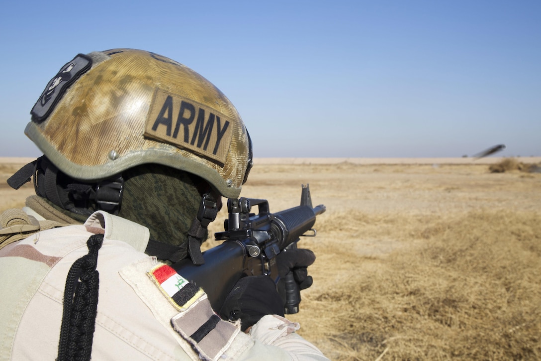 An Iraqi soldier attending the Iraqi Noncommissioned Officer Academy fires his M16 rifle during live fire open terrain maneuver training at Camp Taji, Iraq, Dec. 10, 2016. This training is critical to enabling Iraqi security forces to counter ISIL and regain territory from the terrorist group. Combined Joint Task Force - Operation Inherent Resolve is the global Coalition to defeat ISIL in Iraqi and Syria. (U.S. Army photo by Spc. Craig Jensen)