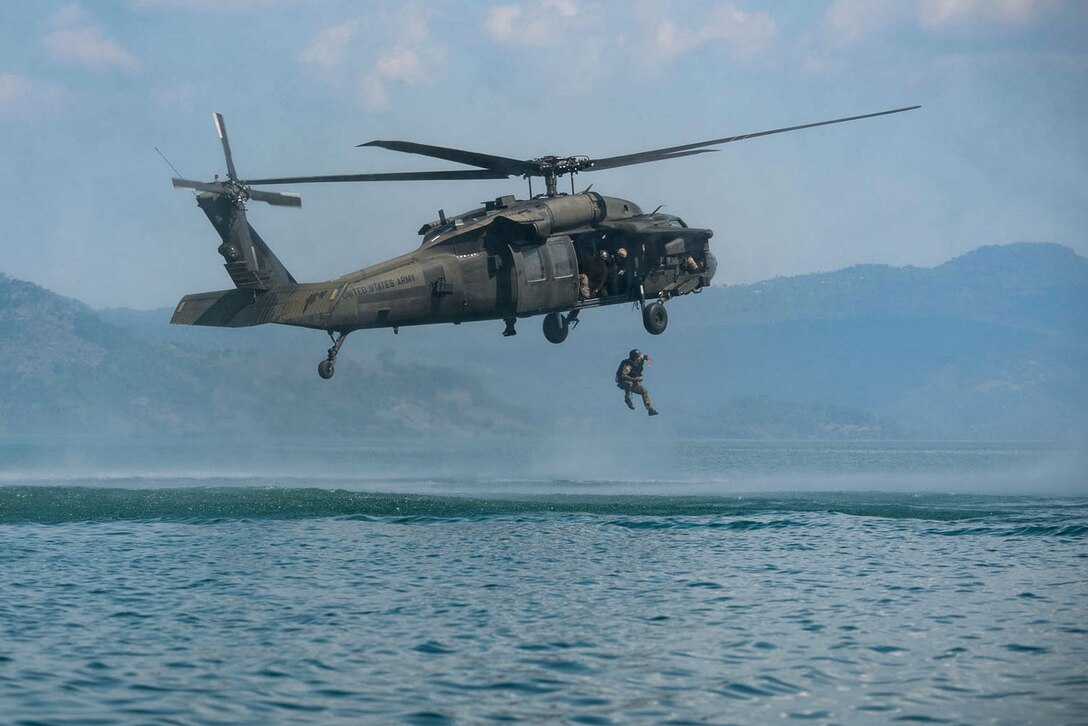 A Salvadoran Special Forces Soldier rappels from a UH-60 Blackhawk helicopter assigned to Joint Task Force-Bravo’s 1st Battalion 228th Aviation Regiment during Operation Serpiente, a joint air assault training mission led by members of the U.S. 7th Special Forces Group, Naval Special Warfare, Nov. 28 – Dec. 2, at Ilopango Airport, El Salvador.