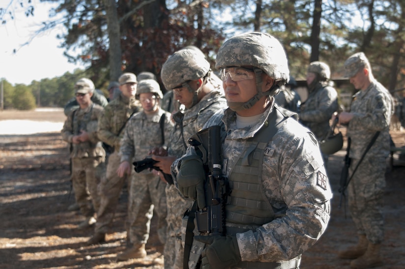 Sgt. Manuel Palaguachi, a supply sergeant assigned to the 365th Engineer Headquarters Company, pauses before a safety brief during weapon qualifications for his Battle Assembly training on Fort Dix, NJ November 5, 2016. Weapon qualifications are part of required training Army Reservist must complete each year to maintain combat readiness.