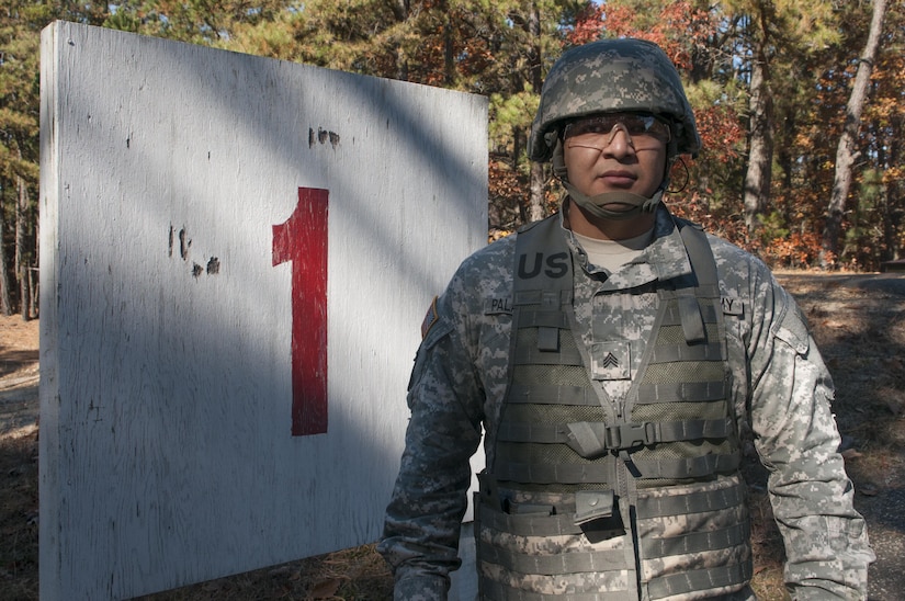 Sgt. Manuel Palaguachi, a supply sergeant assigned to the 365th Engineer Headquarters Company, poses in front of his shooting lane during weapon qualifications for his Battle Assembly training on Fort Dix, NJ November 5, 2016. Weapon qualifications are part of required training Army Reservist must complete each year to maintain combat readiness.