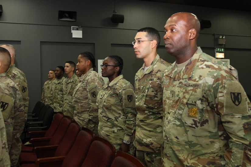 Soldier of the 1st Human Resources Sustainment Center stand during the arrival of the official party during the unit’s transfer of authority ceremony Dec. 6, 2016 at Camp As Sayliyah, Qatar. The 1st HRSC completed their nine‐month deployment to the Middle East and transferred authority to the 14th HRSC during a ceremony.