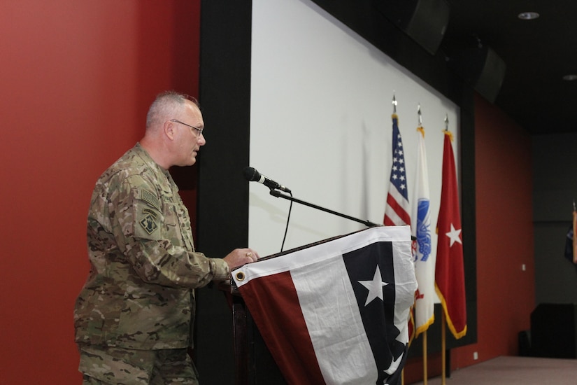 Army Reserve Brig. Gen. Bruce E. Hackett, deputy commanding general of the 1st Theater Sustainment Command‐Operational Command Post, speaks at the 1st Human Resources Sustainment Center’s transfer of authority ceremony, Dec. 6, 2016 at Camp As Sayliyah, Qatar. Hackett presided over the ceremony and welcomed the 14th HRSC leadership and Soldiers to the 1st TSC‐OCP.