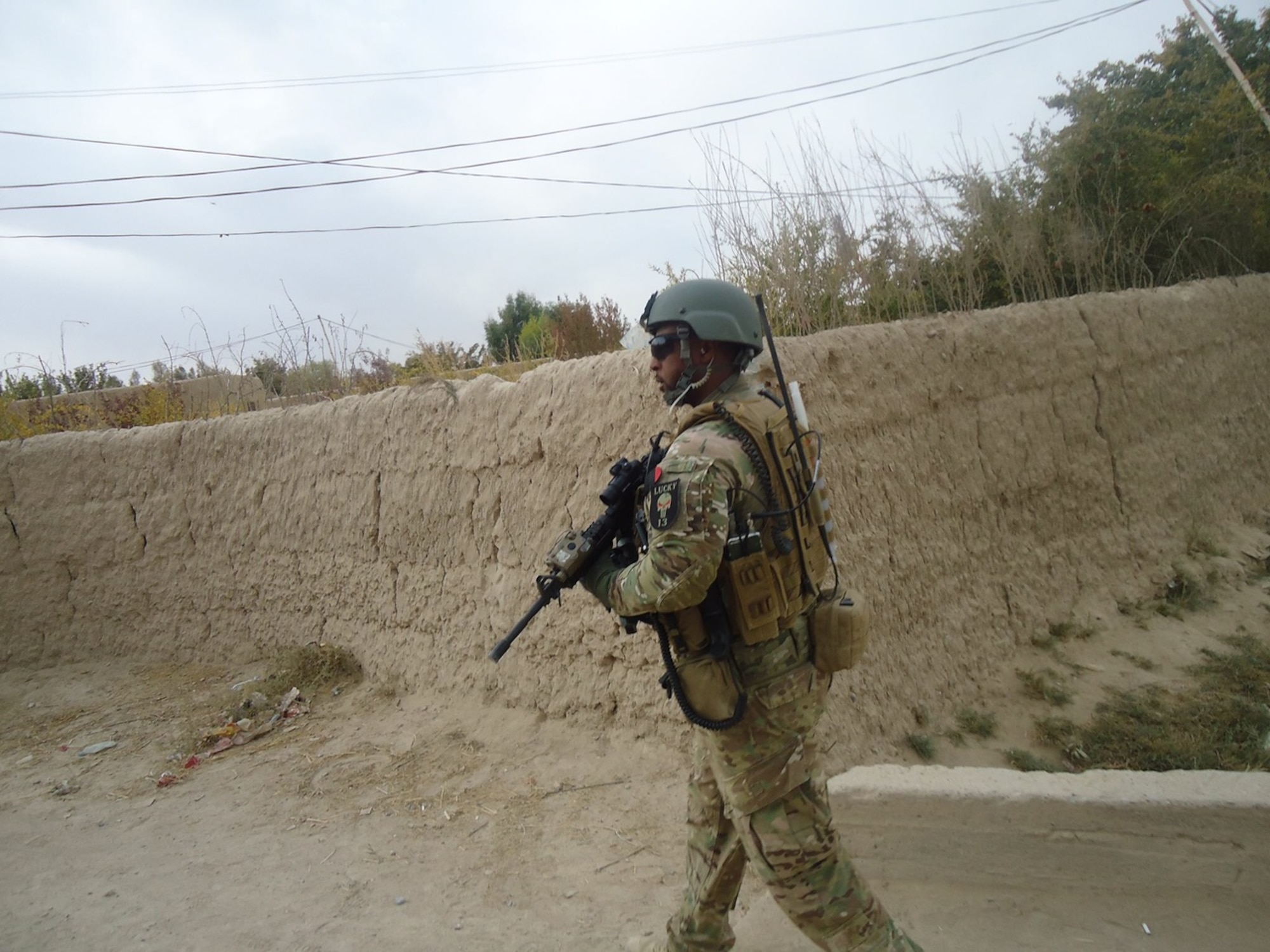 Special Agent Robert Binns, Air Force Office of Special Investigations Detachment 531 superintendent, walks down a street in Afghanistan during his deployment from 2012-2013. Binns and his teammates used counter intelligence and the help from several agencies to gather information and locate enemy forces. (Courtesy photo)