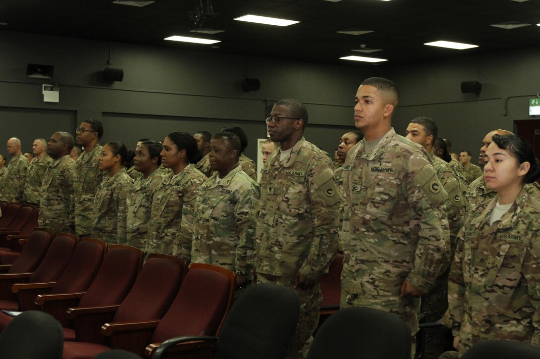 Soldier of the 14st Human Resources Sustainment Center stand during the arrival of the official party during the unit’s transfer of authority ceremony Dec. 6, 2016 at Camp As Sayliyah, Qatar. The 1st HRSC completed their nine‐month deployment to the Middle East and transferred authority to the 14th HRSC during a ceremony.