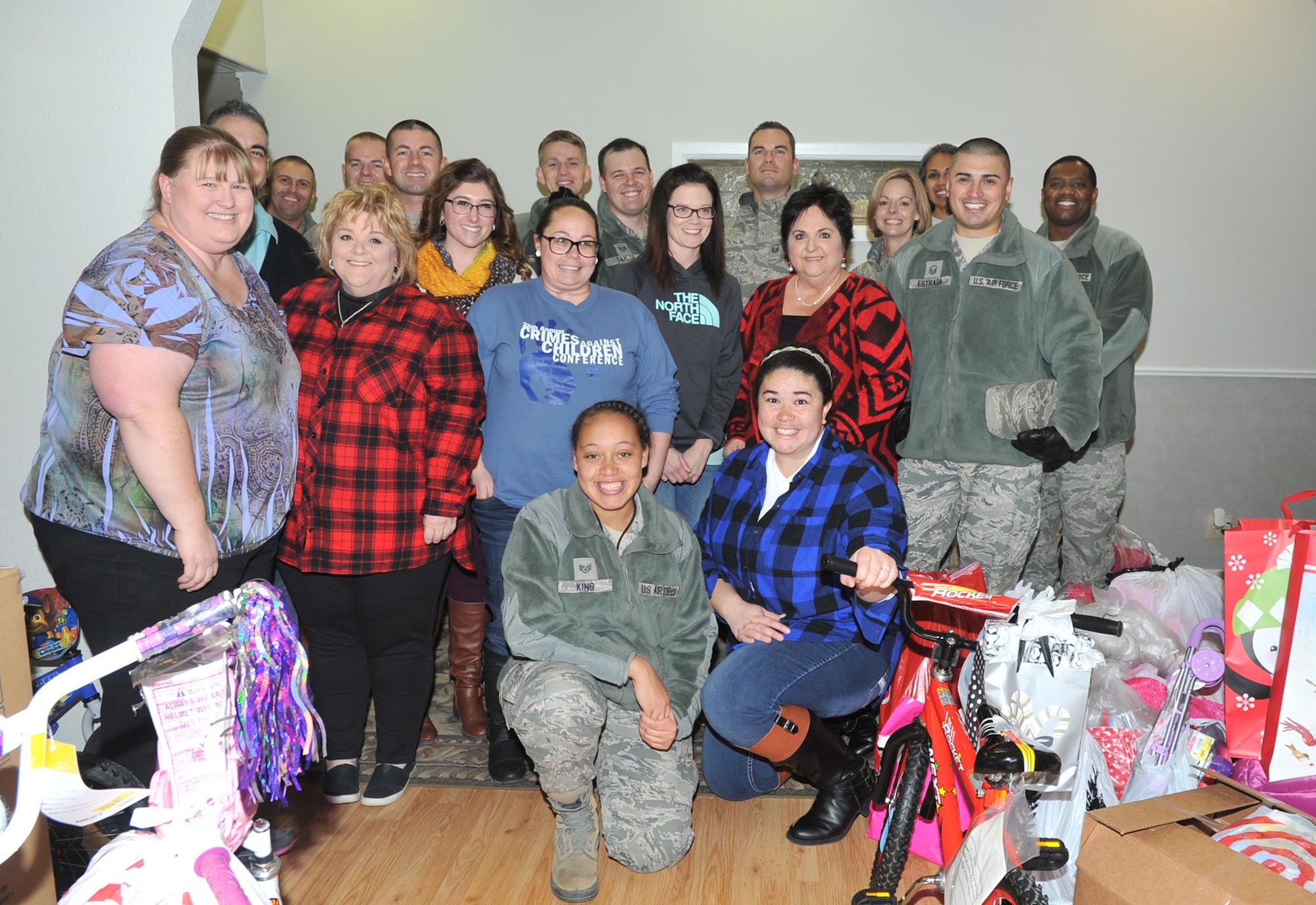 Goodfellow Air Force Base members and Court Appointed Special Advocates for Children center employees at the CASA center, San Angelo, Texas, Dec. 8, 2016. Goodfellow members provided gifts for 340 children in emergency foster care. (U.S. Air Force photo by Staff Sgt. Laura R. McFarlane/Released)