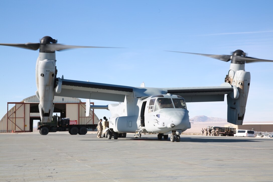 U.S. Marines with Maintenance Management Team, 1st Supply Battalion, 1st Marine Logistics Group, unload a MV-22B Osprey with supplies for Marines participating in exercise Steel Knight at the Strategic Expeditionary Landing Field, Marine Corps Air Ground Combat Center Twentynine Palms, Calif., Dec. 8, 2016. Steel Knight 2017 is a 1st Marine Division-led exercise that exposes Marines and Sailors to skill sets necessary to operate as a fully capable Marine air ground task force. (U.S. Marine Corps photo by PFC Timothy Shoemaker)