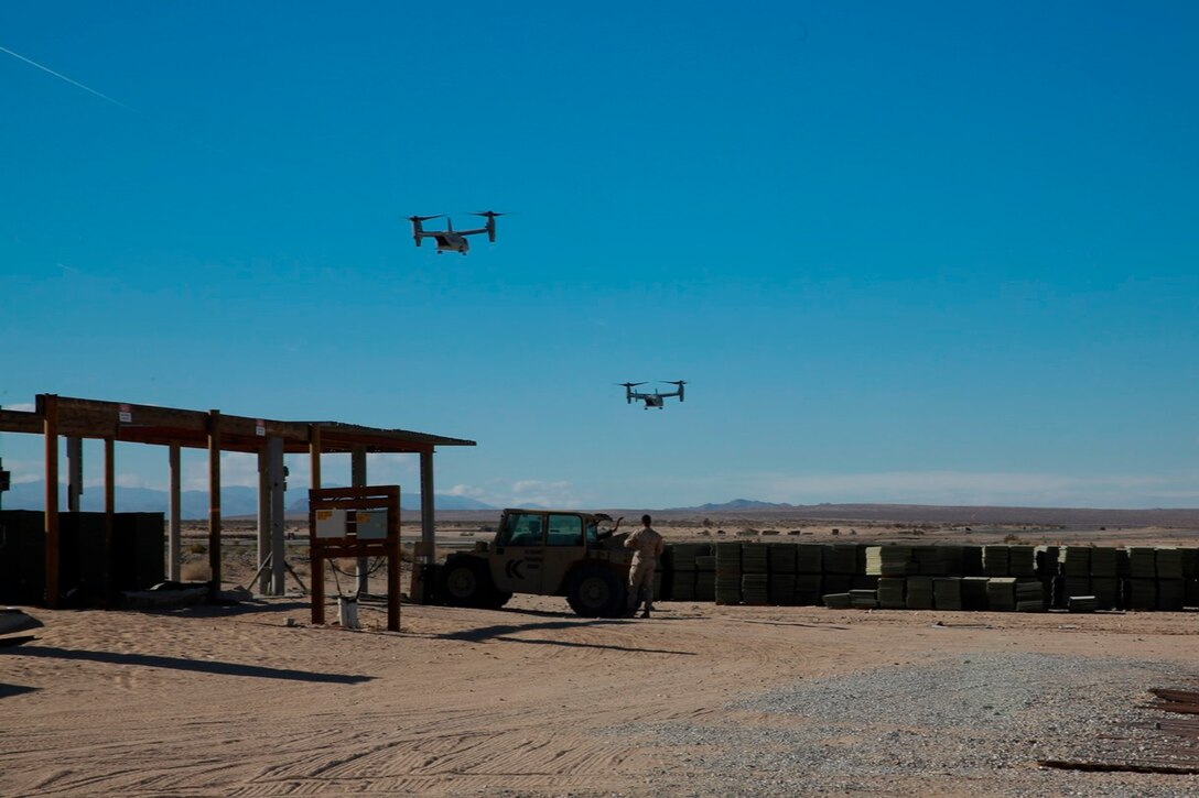 Two MV-22B Ospreys land at the Strategic Expeditionary Landing Field to deliver supplies for Marines participating in exercise Steel Knight at Marine Corps Air Ground Combat Center Twentynine Palms, Calif., Dec. 8, 2016. Steel Knight 2017 is a 1st Marine Division -led exercise that exposes Marines and Sailors to skill sets necessary to operate as a fully capable Marine air ground task force. (U.S. Marine Corps photo by PFC Timothy Shoemaker)