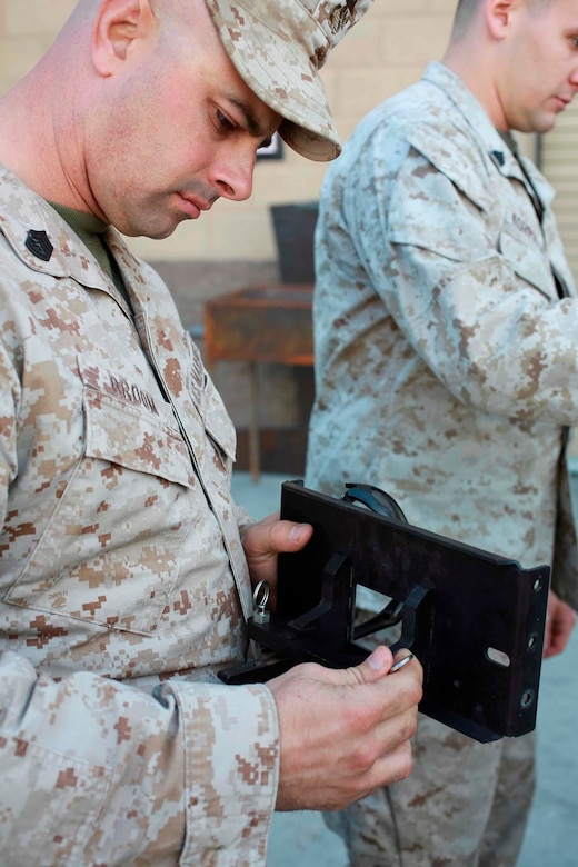 U.S. Marine Gunnery Sgt. Daniel Broom, a machinist with Reparable Maintenance Company, 1st Maintenance Battalion, 1st Marine Logistics Group, inspects a piece that could be printed by a 3-D printer during exercise Steel Knight at Marine Corps Air Ground Combat Center Twentynine Palms, Calif., Dec. 7, 2016. Steel Knight 2017 is a 1st Marine Division-led exercise that exposes Marines and Sailors to skill sets necessary to operate as a fully capable Marine air ground task force. Broom is from Atlanta, Ga. (U.S. Marine Corps photo by PFC Timothy Shoemaker)