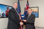Deputy Defense Secretary Bob Work, left, presents a gift to Australian Defense Secretary Dennis Richardson following a meeting at the Pentagon, Dec. 13, 2016. DoD photo by Army Sgt. Amber I. Smith
