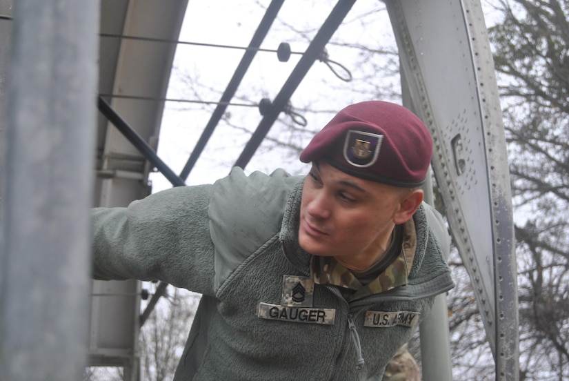 Sgt. 1st Class Christopher L. Gauger, 412th  Civil Affairs Battalion, performs jump master's duties prior to Operation Toy Drop, at the 82nd Airborne Division's Advance Airborne School, on Fort Bragg, NC, on December 6, 2016.  Operation Toy Drop is a collective training and airborne operation conducted by U.S. and partner nation jump masters.  This year, eight nations will conduct airborne operations from December 8 through December 16, 2016. Gauger is from Columbus, Ohio. (U.S. Army Photo by Spc. Jesse L. Artis Jr.)
