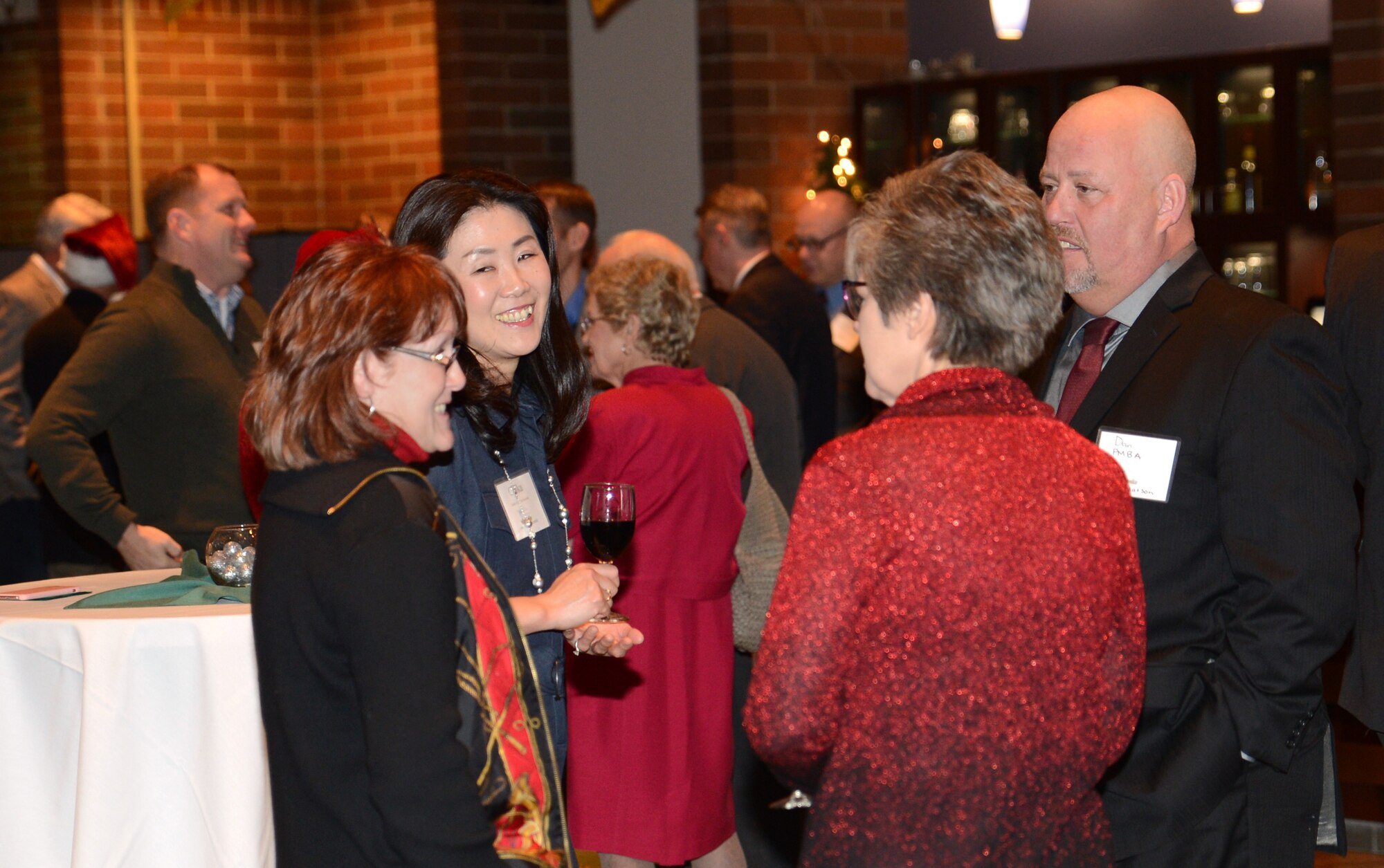 Team McChord civic leaders socialize during the Team McChord annual civic leader holiday party Dec. 10, 2016, at Joint Base Lewis-McChord, Wash. More than 60 Team McChord civic leaders and Team McChord leadership attended the party in honor of civic leaders. (U.S. Air Force photo/Senior Airman Jacob Jimenez) 