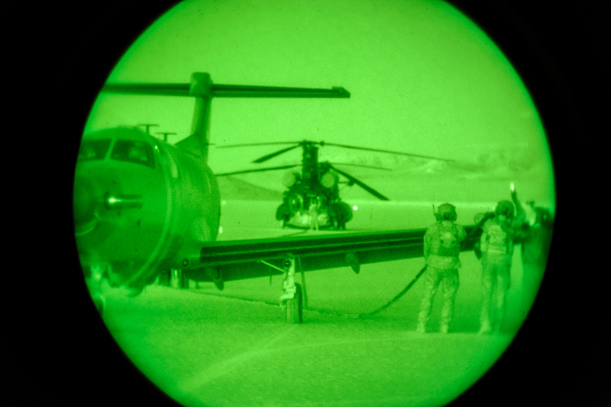 Personnel assigned to the 14th Weapons Squadron, 160th Special Operations Aviation Regiment and 66th WPS execute a landing zone security and forward area refueling point operations between an Army MH-47 and Air Force U-28 aircraft in support of the U.S. Air Force Weapons School Integration Exercise Special Operations Forces Hostage Recovery Mission.  The mission featured 17 aircraft, and more than 200 Army and Air Force personnel. (U.S. Air Force photo by Major Richie Harr,)