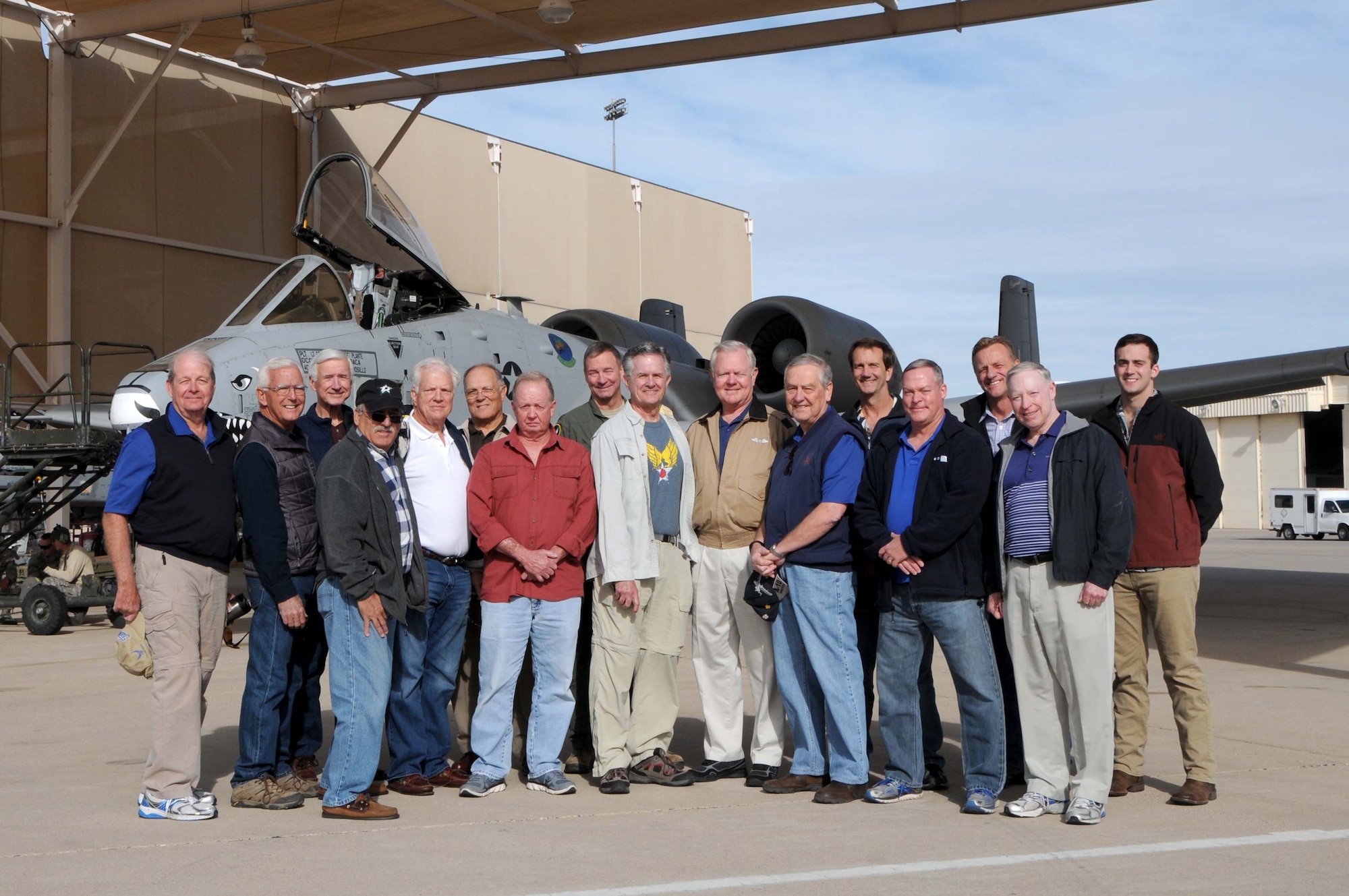 47th Fighter Wing alumni pose for a group photo in front of a A-10C Thunderbolt II at Davis-Monthan Air Force Base, Ariz., Dec. 6, 2016. The alums were invited back to the unit to commemorate the 75th anniversary of the attack on Pearl Harbor where the 47 FS were the first to get into the air and are credited with taking down six enemy aircraft. (U.S. Air Force photo by Tech. Sgt. Courtney Richardson)