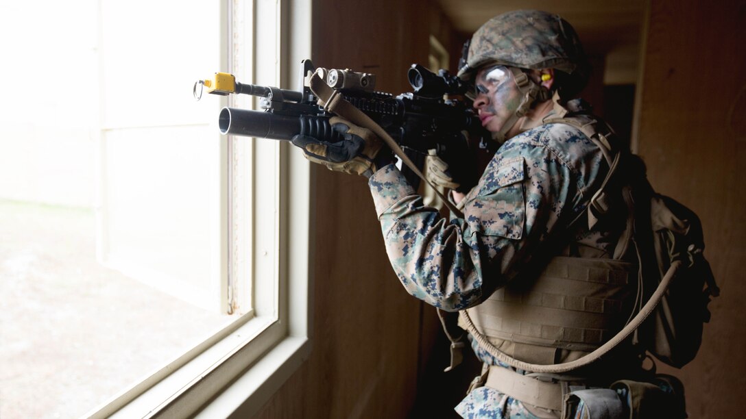 Lance Cpl. Tre Newell cans his sector for simulated targets during a Military Operations Urban Terrain course at Marine Corps Base Camp Lejeune, N.C., Dec. 8th, 2016. MOUT is a combat course that allows Marines to train in an urban environment in which they secure buildings while taking simulated enemy fire. These Marines are with 2nd Battalion, 2nd Marine Regiment, 2nd Marine Division.