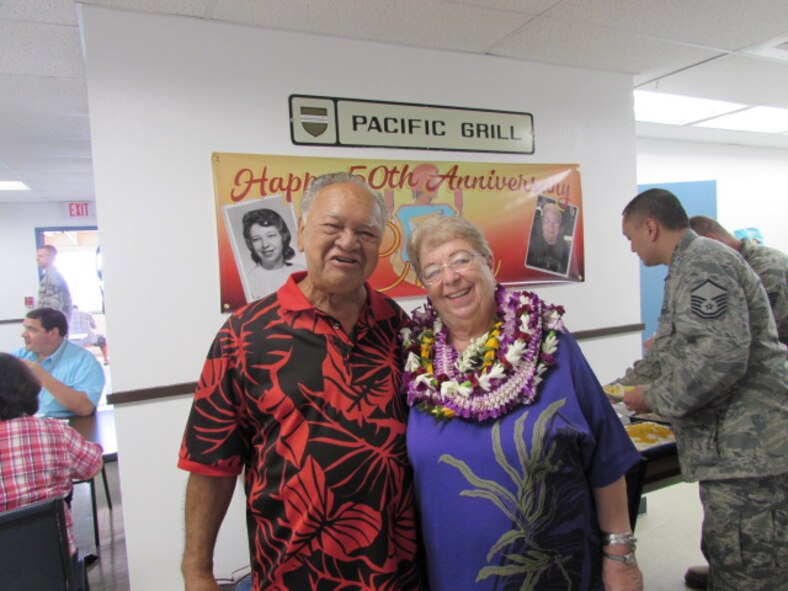 Charlene “Aunty Char” Kaawaloa and her husband Larry smile in front of a poster commemorating Charlene’s 50 years of service at Kaena Point Satellite Tracking Station, Hawaii, Wednesday, Dec. 7, 2016. Kaawaloa started working as a contractor at Kaena Point in 1966, when the station was relatively new.(Courtesy photo)