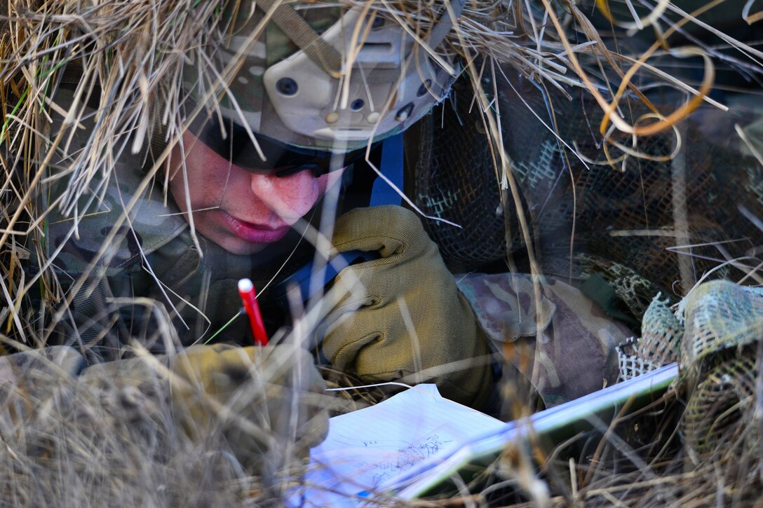 A soldier provides distance and wind speeds to his headquarters company during a live-fire exercise as part of Exercise Mountain Shock at Pocek Range in Slovenia, Dec. 8, 2016. Army photo by Paolo Bovo