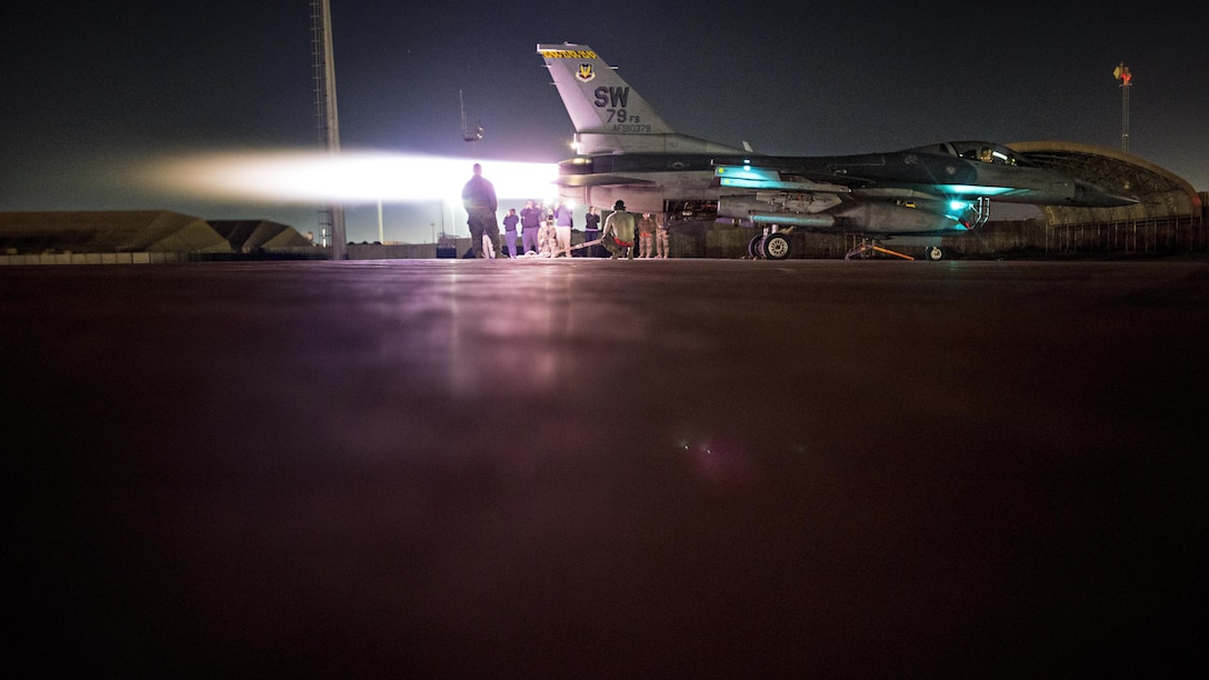 Staff Sgt. Erin Diaz and Senior Airmen Dakota Tabler and Logan Helle, 455th Expeditionary Maintenance Squadron engine technicians, conduct an augmentor operations check on an F-16 Fighting Falcon Dec. 4, 2016 at Bagram Airfield, Afghanistan. The operations check was conducted after installing a new engine component. (U.S. Air Force photo by Staff Sgt. Katherine Spessa)