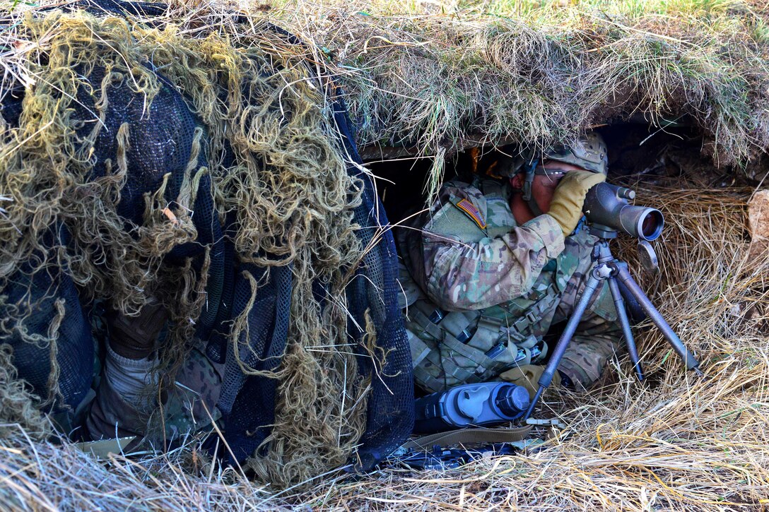 Soldiers use spotter scopes to observe their targets during a live-fire exercise as part of Exercise Mountain Shock at Pocek Range in Slovenia, Dec. 8, 2016. Army photo by Paolo Bovo