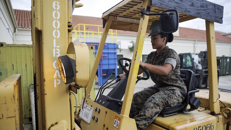 Sgt. Angie Novoa, a warehouse chief with Special Purpose Marine Air-Ground Task Force Crisis Response-Africa, operates a forklift to move heavy boxes on Naval Air Station Sigonella, Italy, Oct. 28, 2016.  Novoa was awarded the non-commissioned officer of the quarter for her exemplary work in and out of the supply shop while deployed with SPMAGTF-CR-AF.