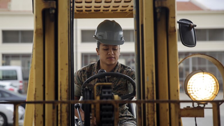 Sgt. Angie Novoa, a warehouse chief with Special Purpose Marine Air-Ground Task Force Crisis Response-Africa, operates a forklift outside of her warehouse on Naval Air Station Sigonella, Italy, Oct. 28, 2016.  Novoa was awarded the non-commissioned officer of the quarter for her exemplary work in and out of the supply shop while deployed with SPMAGTF-CR-AF.