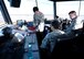 U.S. Air Force air traffic controllers from the 325th Operations Support Squadron discuss and record aircraft movement at Tyndall Air Force Base, Fla., Dec. 12, 2016, during exercise Checkered Flag 17-1 and Combat Archer 17-3. Their mission is to control air traffic by use of visual, radar and non-radar methods while providing a safe and orderly flow of aircraft. (U.S. Air Force photo by Airman 1st Class Isaiah J. Soliz/Released)