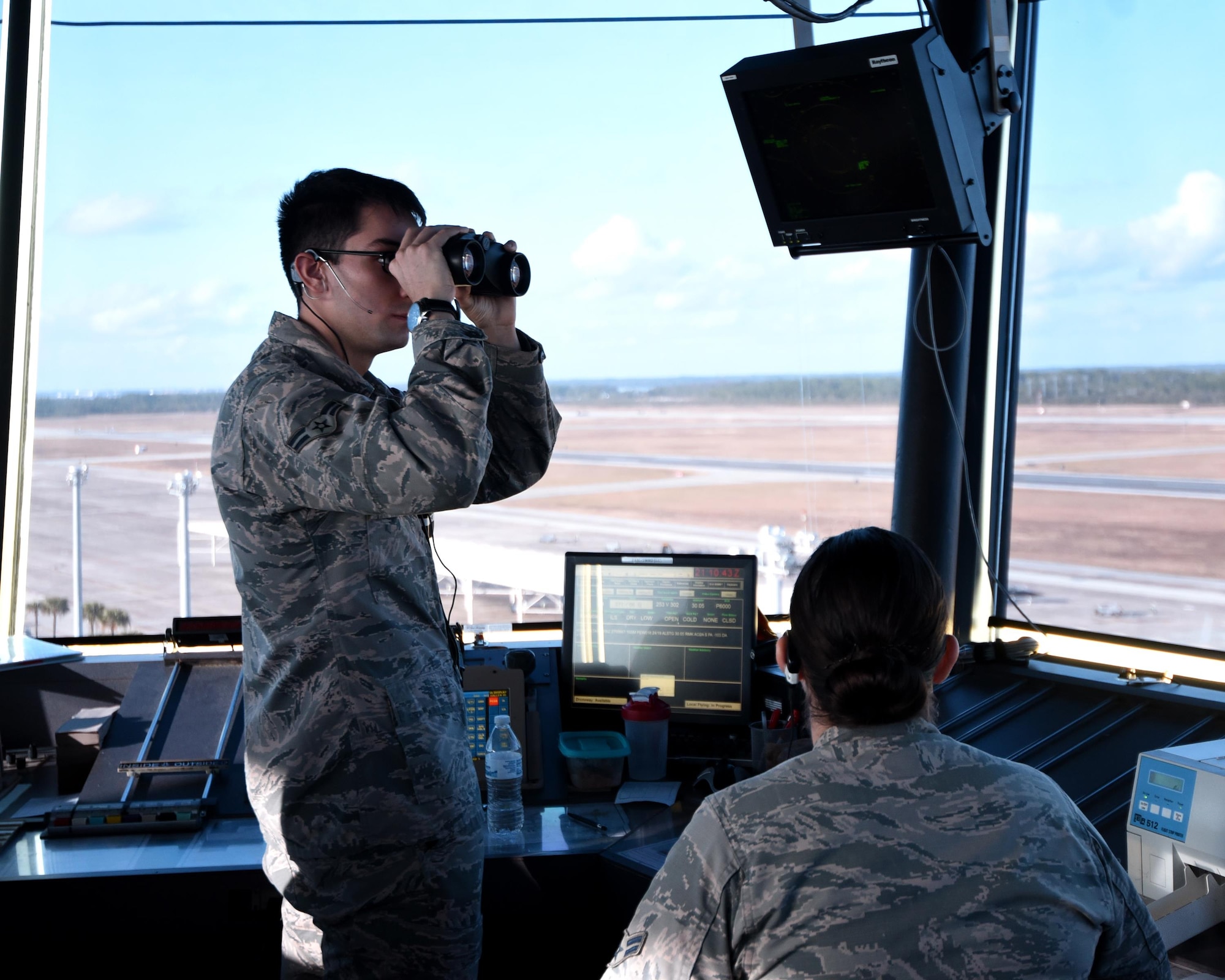 U.S. Air Force Airmen 1st Class Nicolas Flores and Tessa Alzuri, air traffic control journeymen from the 325th Operations Support Squadron, monitor and track incoming aircraft during exercise Checkered Flag 17-1 at Tyndall Air Force Base, Fla., Dec. 12, 2016. Tyndall’s air traffic controllers are responsible for an additional 40 aircraft during concurrent exercises Checkered Flag 17-1 and Combat Archer 17-3, Dec. 5-16. (U.S. Air Force photo by Airman 1st Class Isaiah J. Soliz/Released)