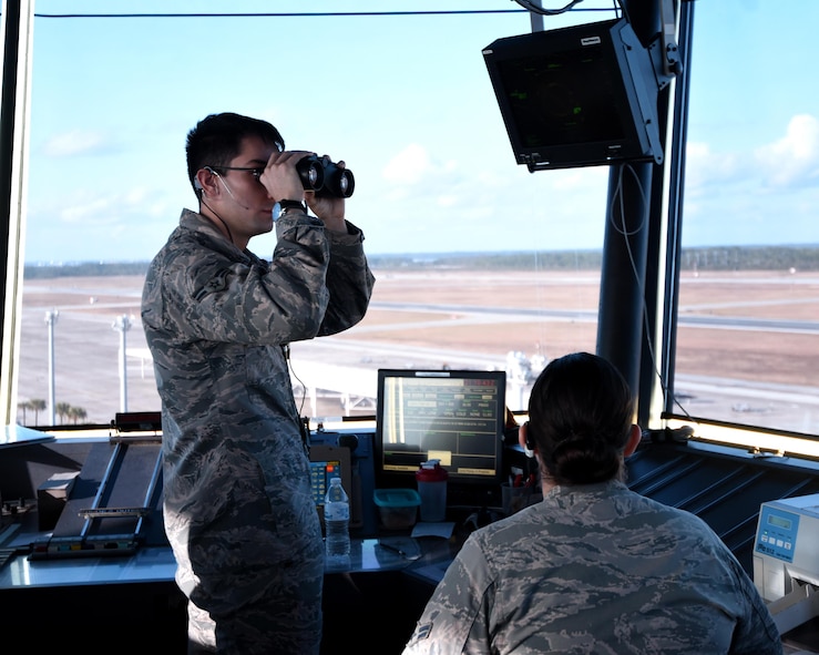 U.S. Air Force Airmen 1st Class Nicolas Flores and Tessa Alzuri, air traffic control journeymen from the 325th Operations Support Squadron, monitor and track incoming aircraft during exercise Checkered Flag 17-1 at Tyndall Air Force Base, Fla., Dec. 12, 2016. Tyndall’s air traffic controllers are responsible for an additional 40 aircraft during concurrent exercises Checkered Flag 17-1 and Combat Archer 17-3, Dec. 5-16. (U.S. Air Force photo by Airman 1st Class Isaiah J. Soliz/Released)
