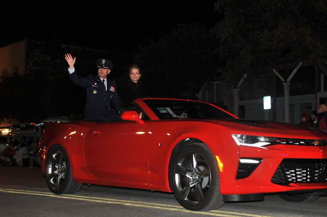 U.S. Air Force Col. Michael Downs, 17th Training Wing Commander, and Leah Downs, ride in the “Lights of Christmas” parade in downtown San Angelo, Texas, Dec. 10, 2016. The Concho Christmas Celebration committee invited Downs to be the grand marshall for the parade. (U.S. Air Force photo by Staff Sgt. Laura R. McFarlane/Released)