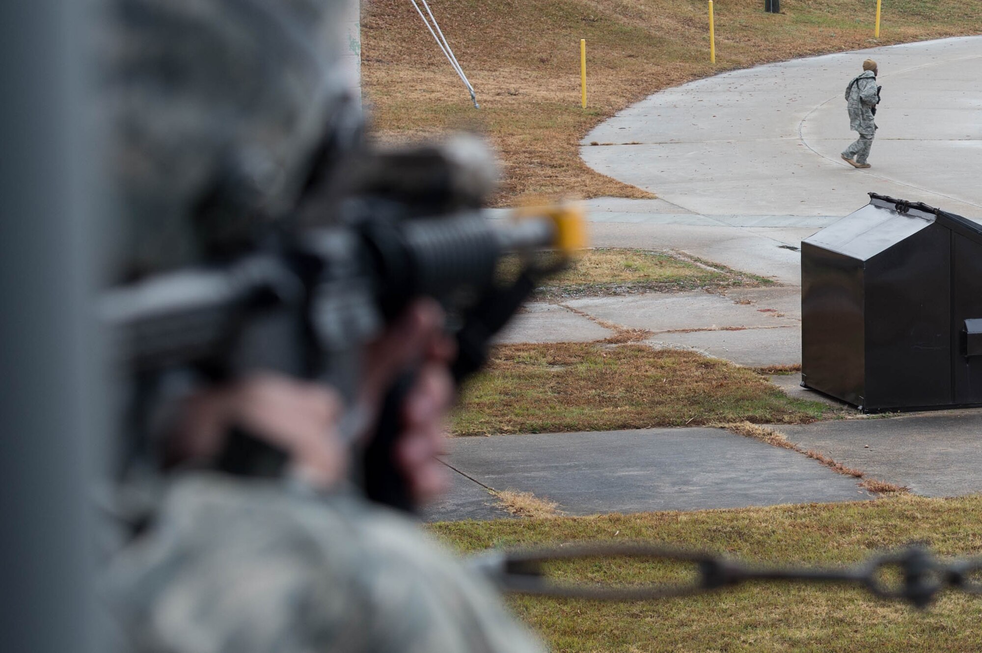A U.S. Air Force Airman assigned to the 633rd Security Forces Squadron aims at a simulated aggressor during exercise Operation Resolute Endeavor II at Joint Base Langley-Eustis, Va., Dec. 5, 2016. Members of the 633rd SFS and U.S. Army roleplayed as aggressors to test the SFS’ capabilities in securing a port. (U.S. Air Force photo by Airman 1st Class Derek Seifert)