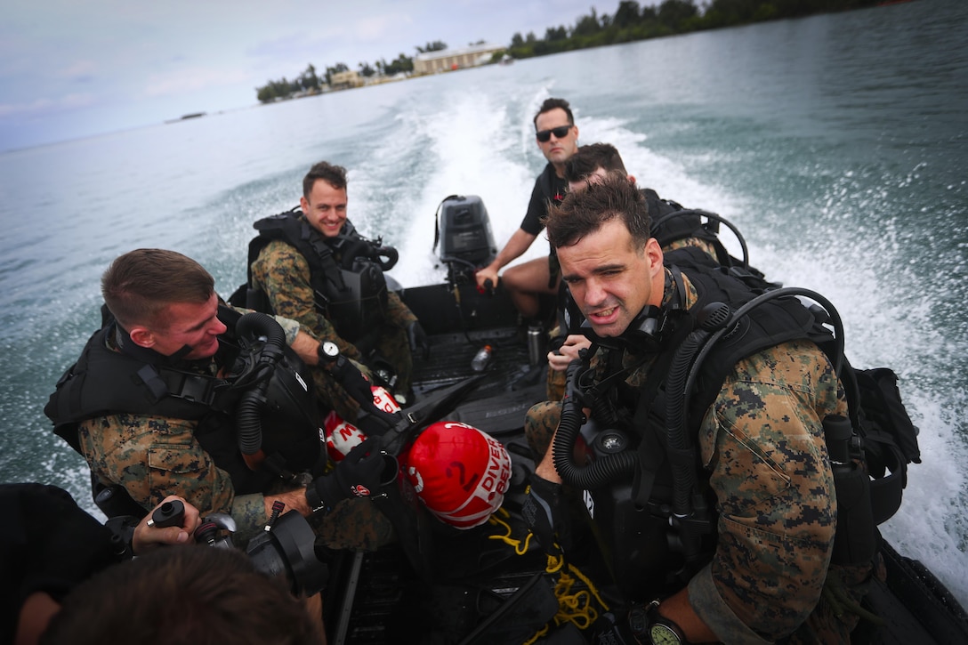 Marines with 4th Force Reconnaissance Battalion ride a combat rubber raiding craft during dive operations in Kaneohe Bay, Hawaii, Dec. 9, 2016. The mission of Marine Corps Base Hawaii is to provide facilities, programs and services in direct support of units, individuals and families in order to enhance and sustain combat readiness for all operating forces and tenant organizations aboard MCB Hawaii. (U.S. Marine Corps photo by Cpl. Aaron S. Patterson/Released)