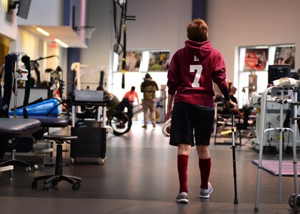 Kianni Martinez walks to her next exercise during her rehabilitation session at the Center for the Intrepid at Joint Base San Antonio-Fort Sam Houston, Texas, Dec. 7, 2016. During the Brussels Airport bombing March 22, 2016, that tragically killed her mother and injured her family members, Kianni suffered multiple burns and injuries to her leg and has since undergone a number of grueling rehabilitative procedures. (U.S. Air Force photo by Senior Airman Chip Pons)