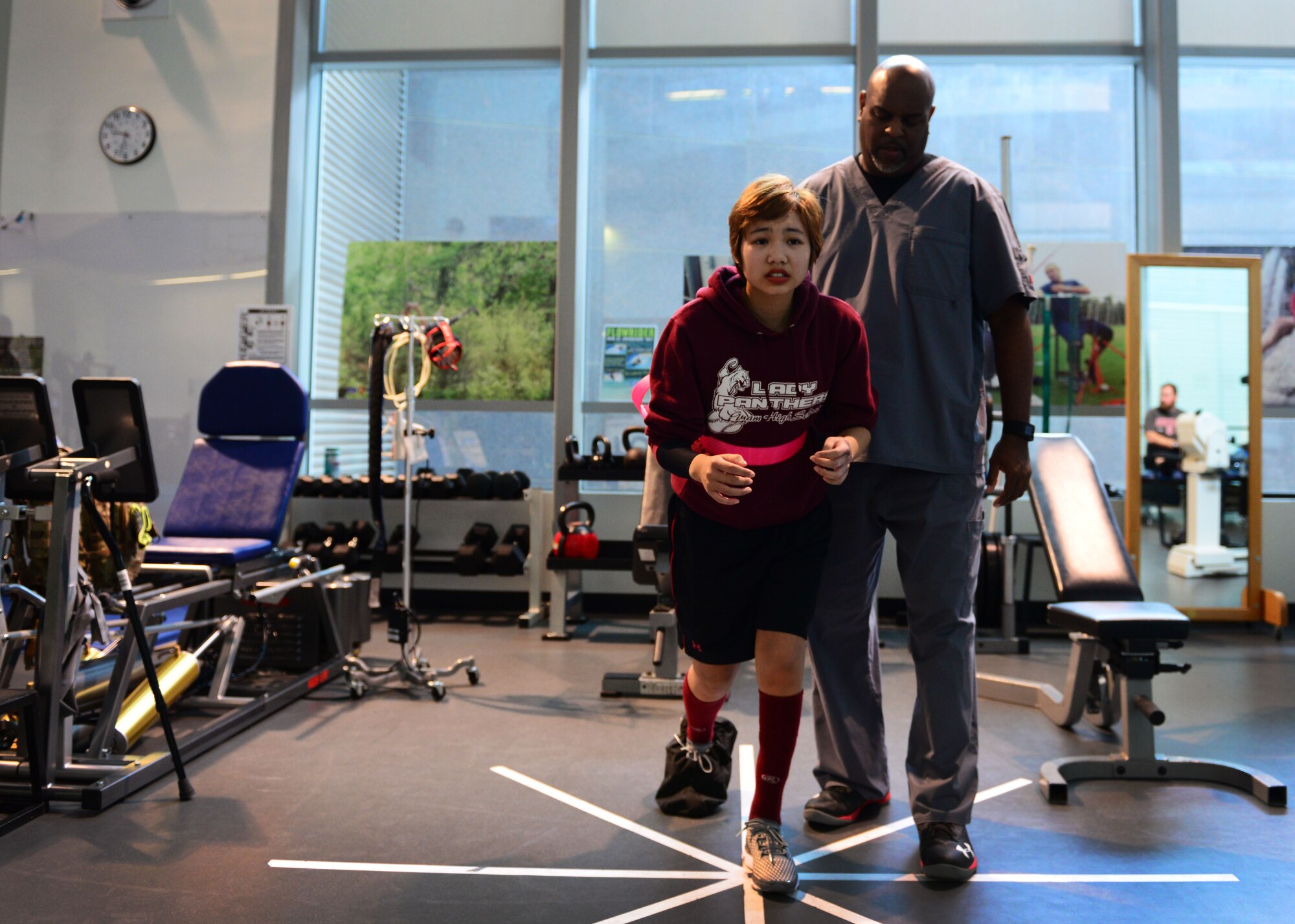 Kianni Martinez performs an exercise during a rehabilitation session at the Center for the Intrepid at Joint Base San Antonio-Fort Sam Houston, Texas, Dec. 7, 2016. During the Brussels Airport bombing March 22, 2016 that tragically killed her mother and injured her family members, Kianni suffered multiple burns and injuries to her leg and has since undergone a number of grueling rehabilitative procedures. (U.S. Air Force photo by Senior Airman Chip Pons)