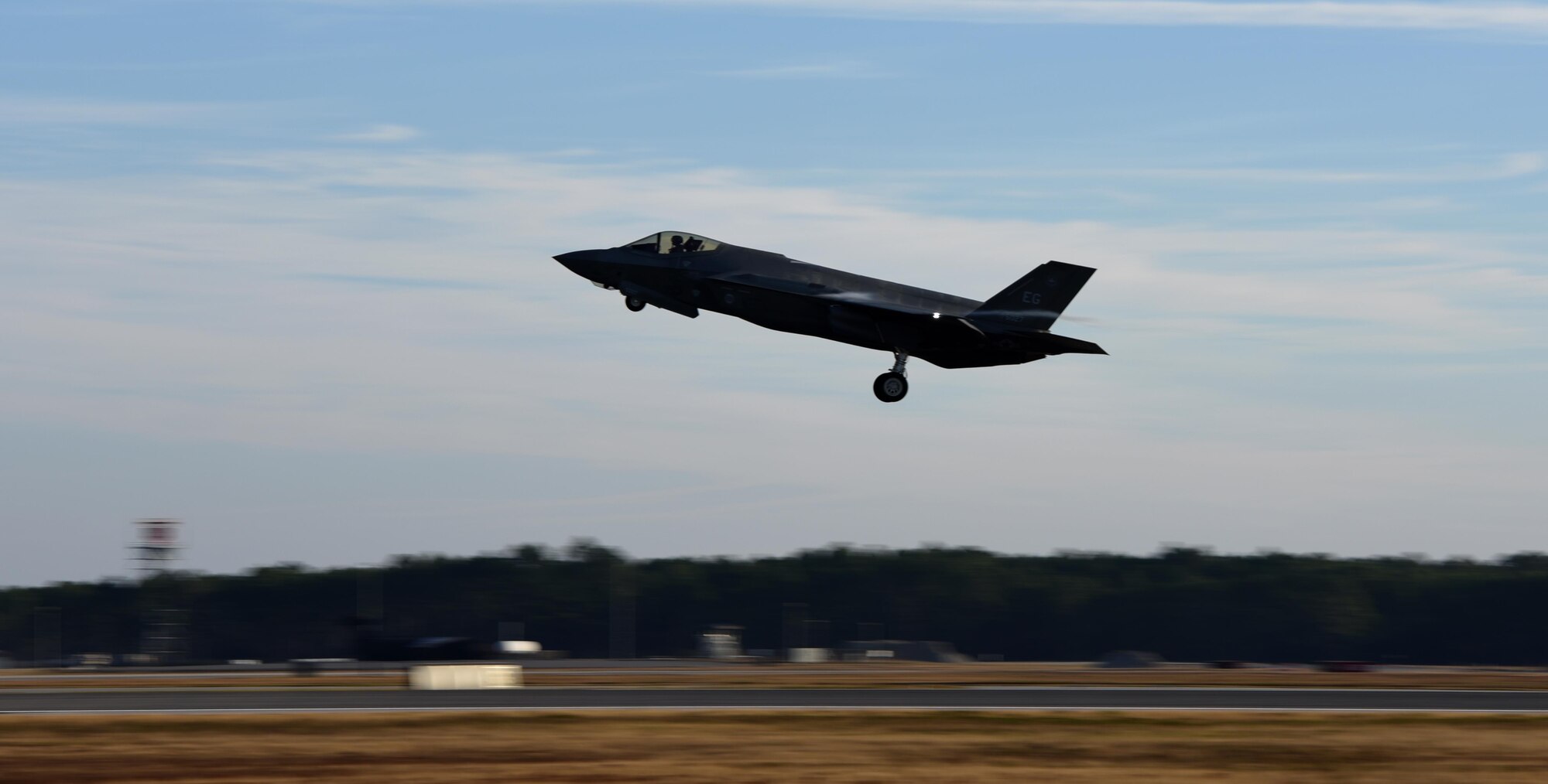 An F-35A Lightning II takes off to practice combat sorties with over 60 other aircraft in exercise Checkered Flag Dec. 8, 2016, at Tyndall Air Force Base, Florida. The 33d Fighter Wing deployed six F-35A Lightning II and 95 personnel to Checkered Flag 17-1. Checkered Flag is a combat rehearsal where 15 aircraft platforms take to the skies to fly realistic and large-scale operations to prepare for contingency operations.  Specifically, this exercise tested the range of capabilities for the F-35A and the 33 FW student and instructor pilots, maintainers, air battle managers and intel by operating from two locations. (U.S. Air Force photo by Staff Sgt. Peter Thompson)