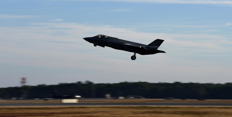 An F-35A Lightning II takes off to practice combat sorties with over 60 other aircraft in exercise Checkered Flag Dec. 8, 2016, at Tyndall Air Force Base, Florida. The 33d Fighter Wing deployed six F-35A Lightning II and 95 personnel to Checkered Flag 17-1. Checkered Flag is a combat rehearsal where 15 aircraft platforms take to the skies to fly realistic and large-scale operations to prepare for contingency operations.  Specifically, this exercise tested the range of capabilities for the F-35A and the 33 FW student and instructor pilots, maintainers, air battle managers and intelligence officers by operating from two locations. (U.S. Air Force photo by Staff Sgt. Peter Thompson)