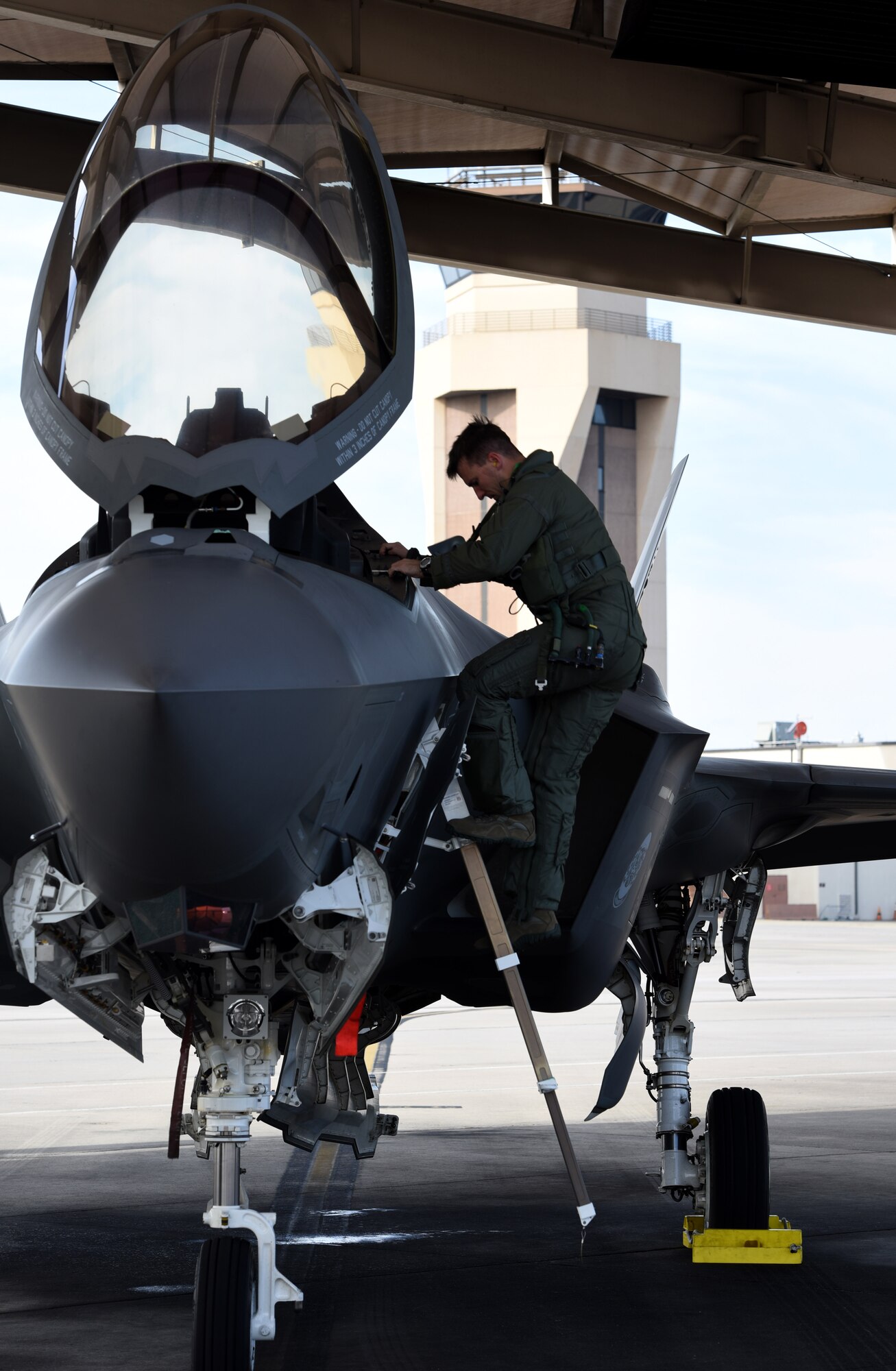 Maj. Brad Zimmerman, 33d Operations Support Squadron assistant chief of weapons, exits the cockpit of an F-35A Lightning II after a combat training sortie in exercise Checkered Flag Dec. 8, 2016, at Tyndall Air Force Base, Florida. The 33d Fighter Wing deployed six F-35A Lightning II and 95 personnel to Checkered Flag 17-1. Checkered Flag is a combat rehearsal where 15 aircraft platforms take to the skies to fly realistic and large-scale operations to prepare for contingency operations.  Specifically, this exercise tested the range of capabilities for the F-35A and the 33 FW student and instructor pilots, maintainers, air battle managers and intel by operating from two locations. (U.S. Air Force photo by Staff Sgt. Peter Thompson)