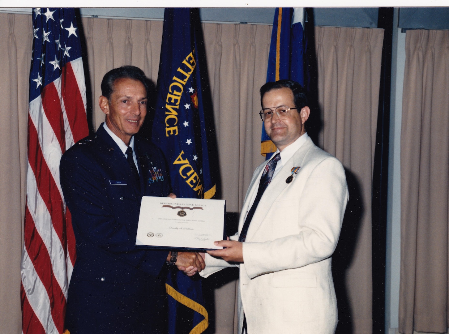 Timothy Pinkham Receives the DIA Directors Award from Major General Richard Carr, 1991