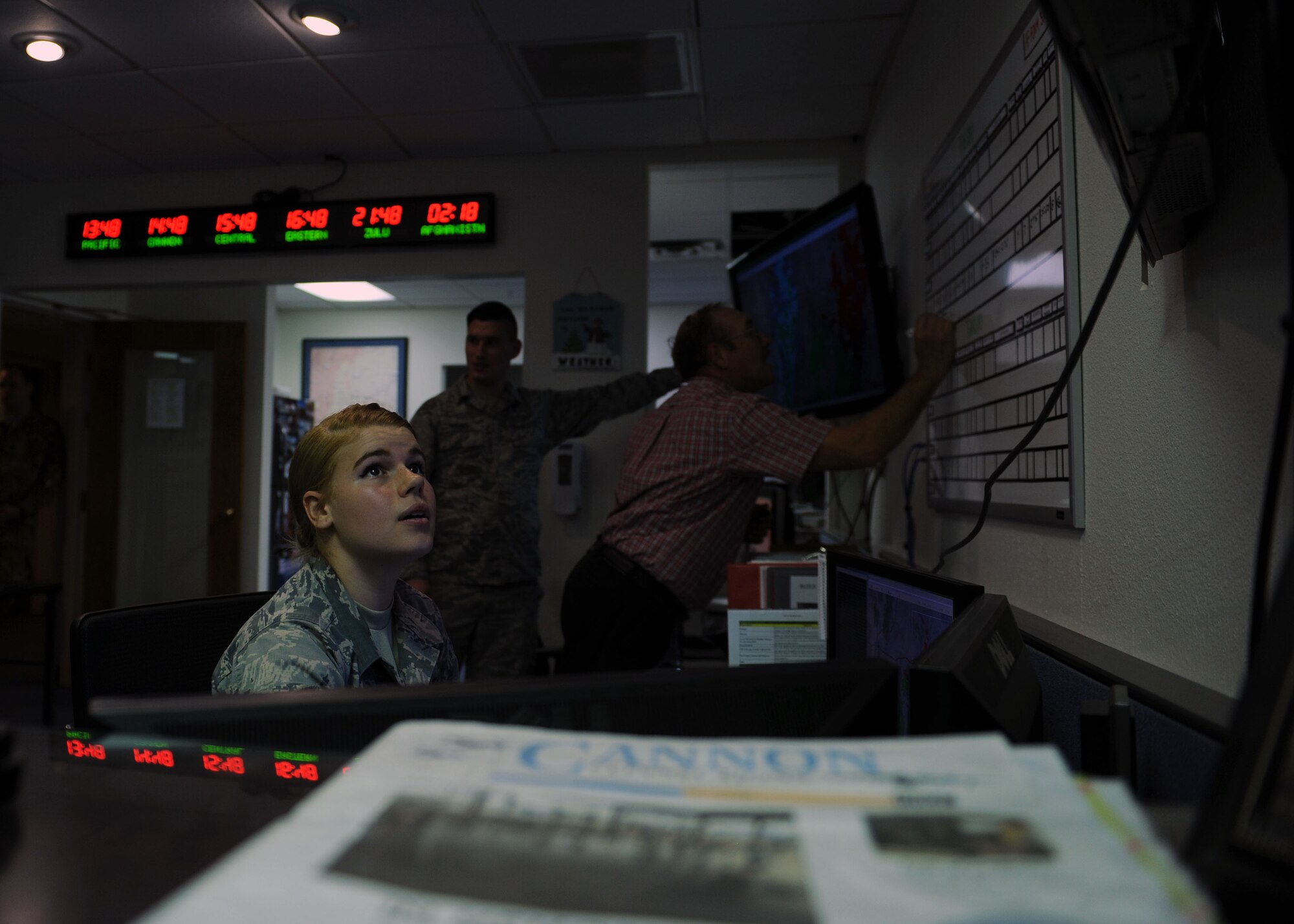 Airman 1st Class Jessie Cox, 27th Special Operations Support Squadron weather forecaster apprentice, monitors systems at base operations, Nov. 21, 2016 at Cannon Air Force Base, N.M. Cannon’s unique environmental position requires forecasters to specialize in area-specific details in order to make accurate predictions. (U.S. Air Force photo by Staff Sgt. Whitney Amstutz/released)