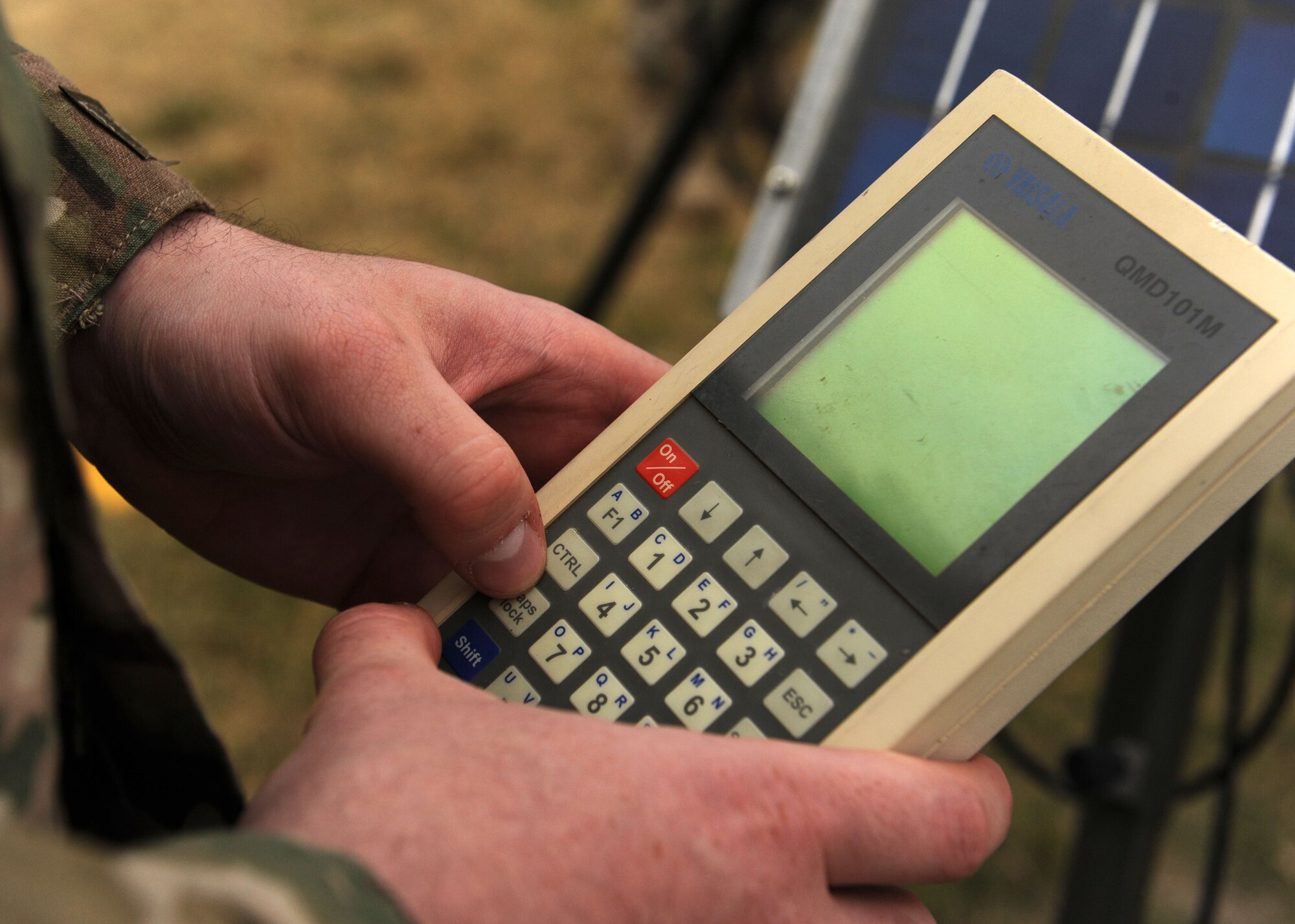 Senior Airman Eric Jackson, 27th Special Operations Support Squadron weather forecaster, fires up a portable handheld display which transmits information received by the tactical weather sensor, TMQ53 on the flightline, Nov. 21, 2016 at Cannon Air Force Base, N.M. Weather forecasters at Cannon are responsible for creating forecasts pertinent to day-to-day base operations, flight operations, and contingency operations from installation to installation. (U.S. Air Force photo by Staff Sgt. Whitney Amstutz/released)