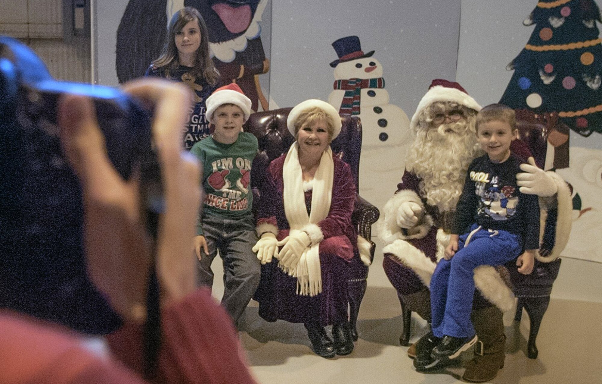 Santa and Mrs. Claus visited with Team Vance children Dec. 10 during "Snapshots with Santa" in Hangar 170, at Vance Air Force Base, Oklahoma. (U.S. Air Force photo/ David Poe)